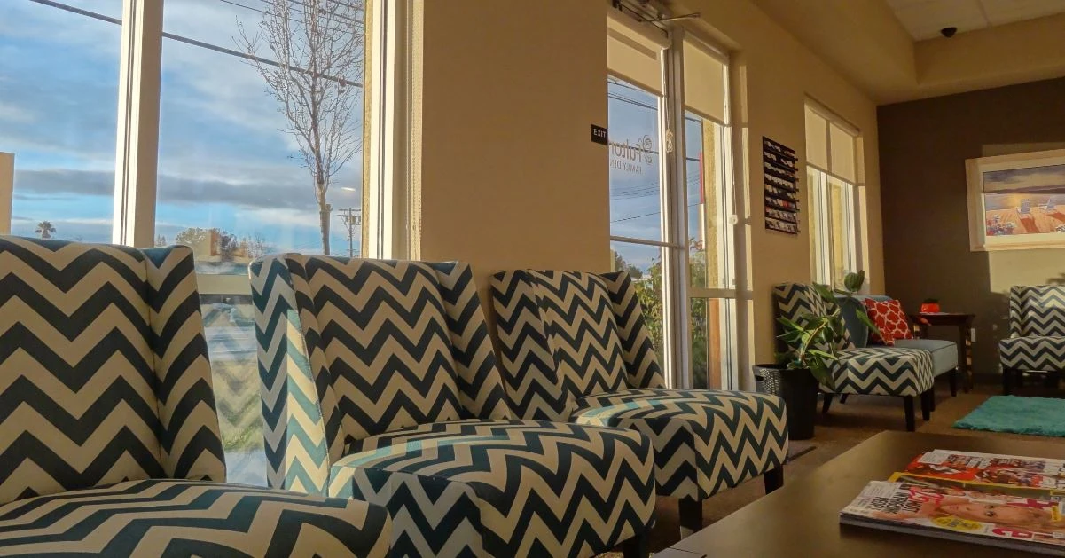 Sunlit waiting lounge at Fulton Family Dental