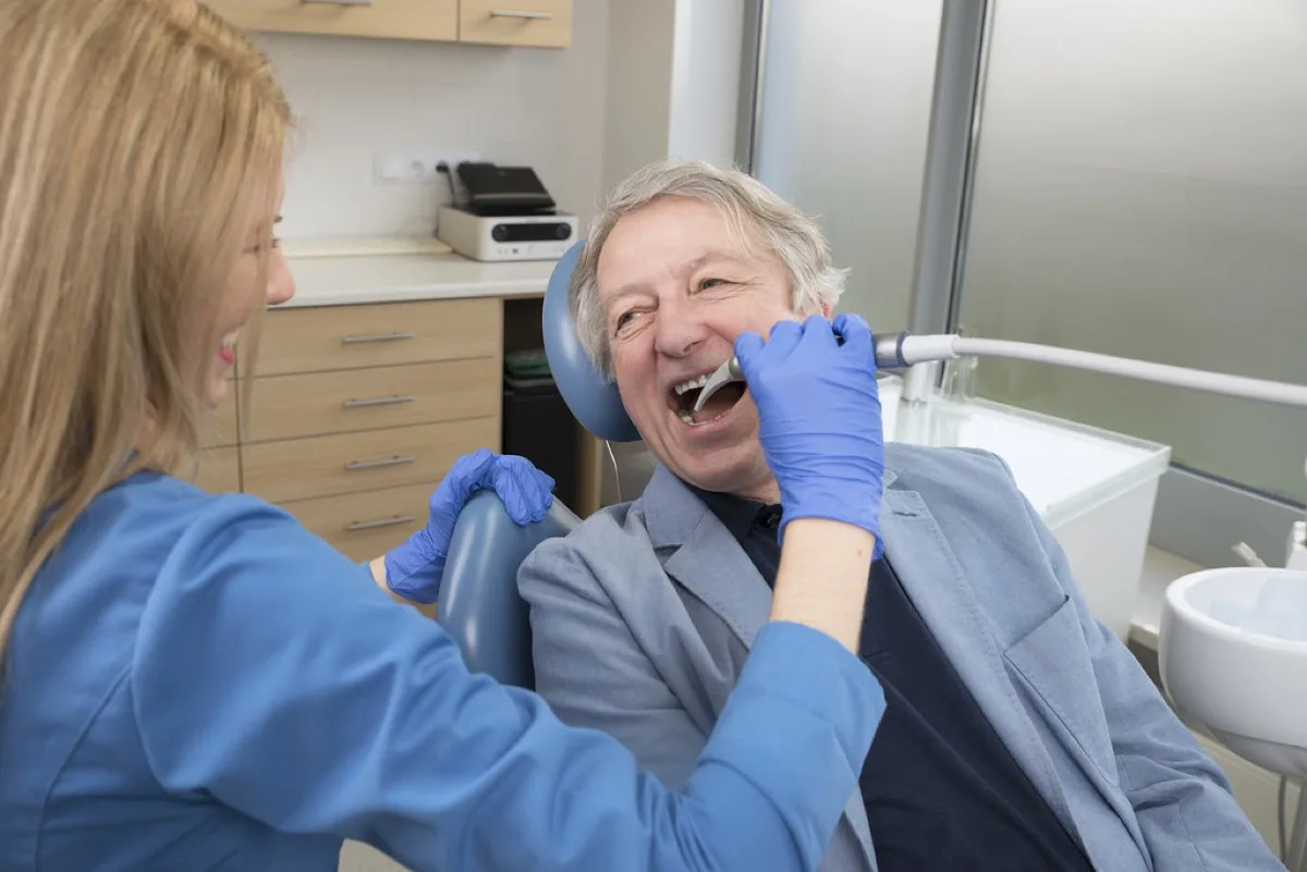 Patient smiling in the dental chair during a same-day visit