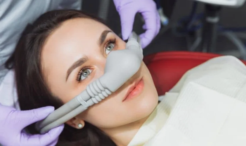 Relaxed patient receiving nitrous oxide sedation at the dentist